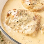 Close up of Chicken Au Poivre in a skillet with cream sauce.