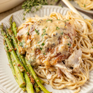 Chicken Au Poivre on pasta with asparagus.
