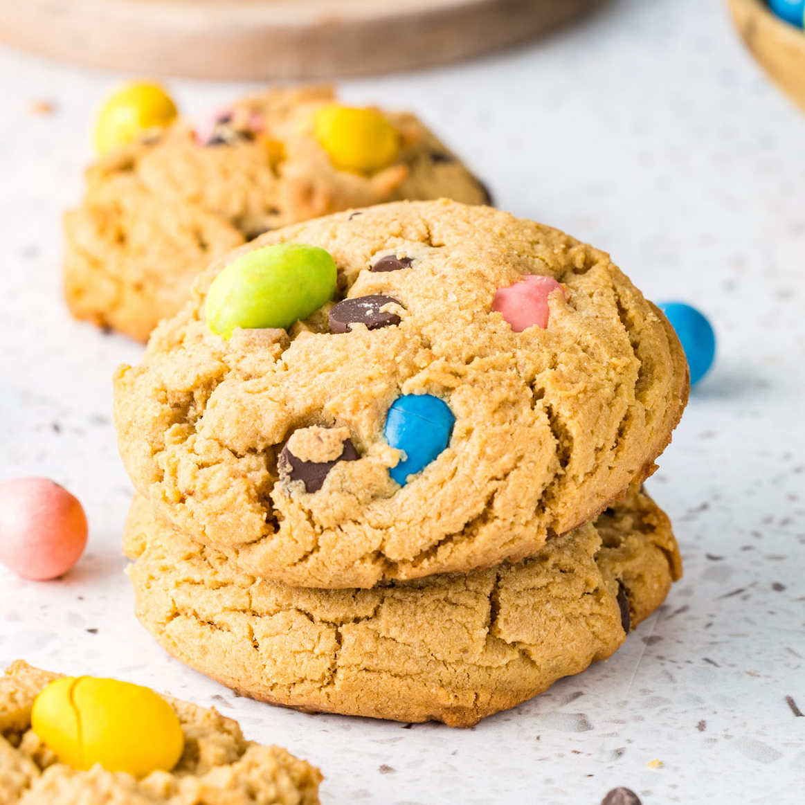 Easter peanut butter cookies on a stone surface with Easter egg candies