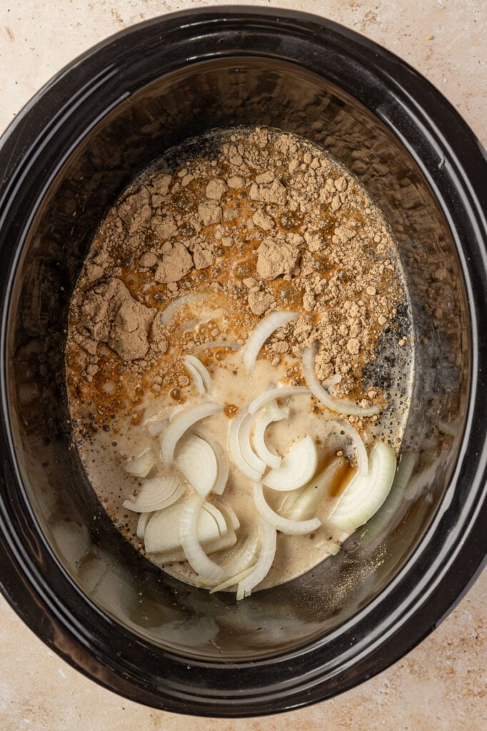 Coca-Cola, Gravy packet, onions, cheese broth in a slow cooker