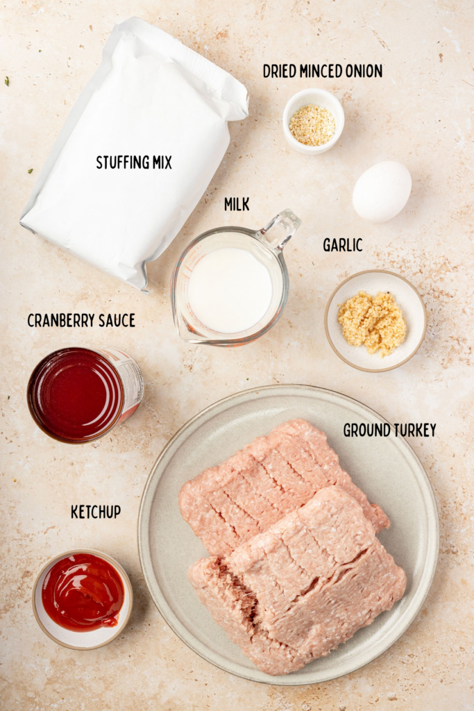 All the ingredients for the Thanksgiving meatloaf in individual mixing bowls or plate plates.