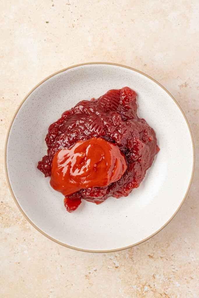 Cranberry jelly sauce, and ketchup in a mixing bowl