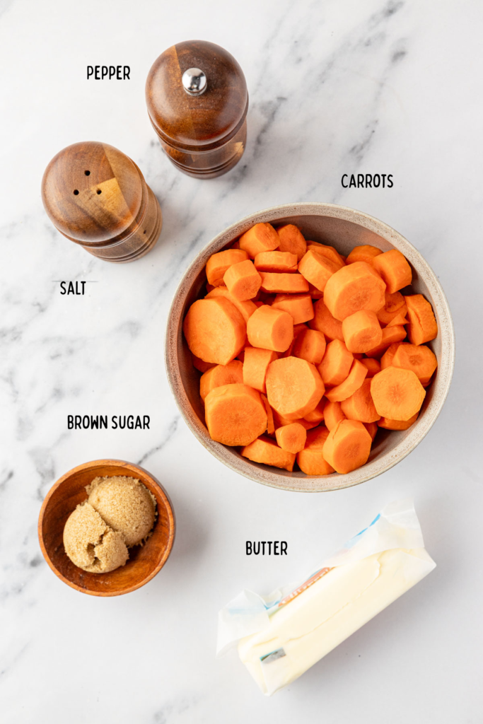 Ingredients for Brown Sugar Glazed Carrots, including sliced carrots, dark brown sugar, butter, and seasonings.