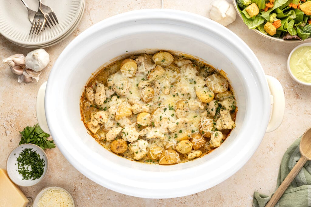 Slow Cooker Garlic Parmesan Chicken And Potatoes in a crockpot
