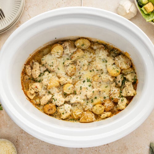 Slow Cooker Garlic Parmesan Chicken And Potatoes in a crockpot